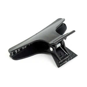 A single black butterfly hair clip with a metal alligator clip mechanism.