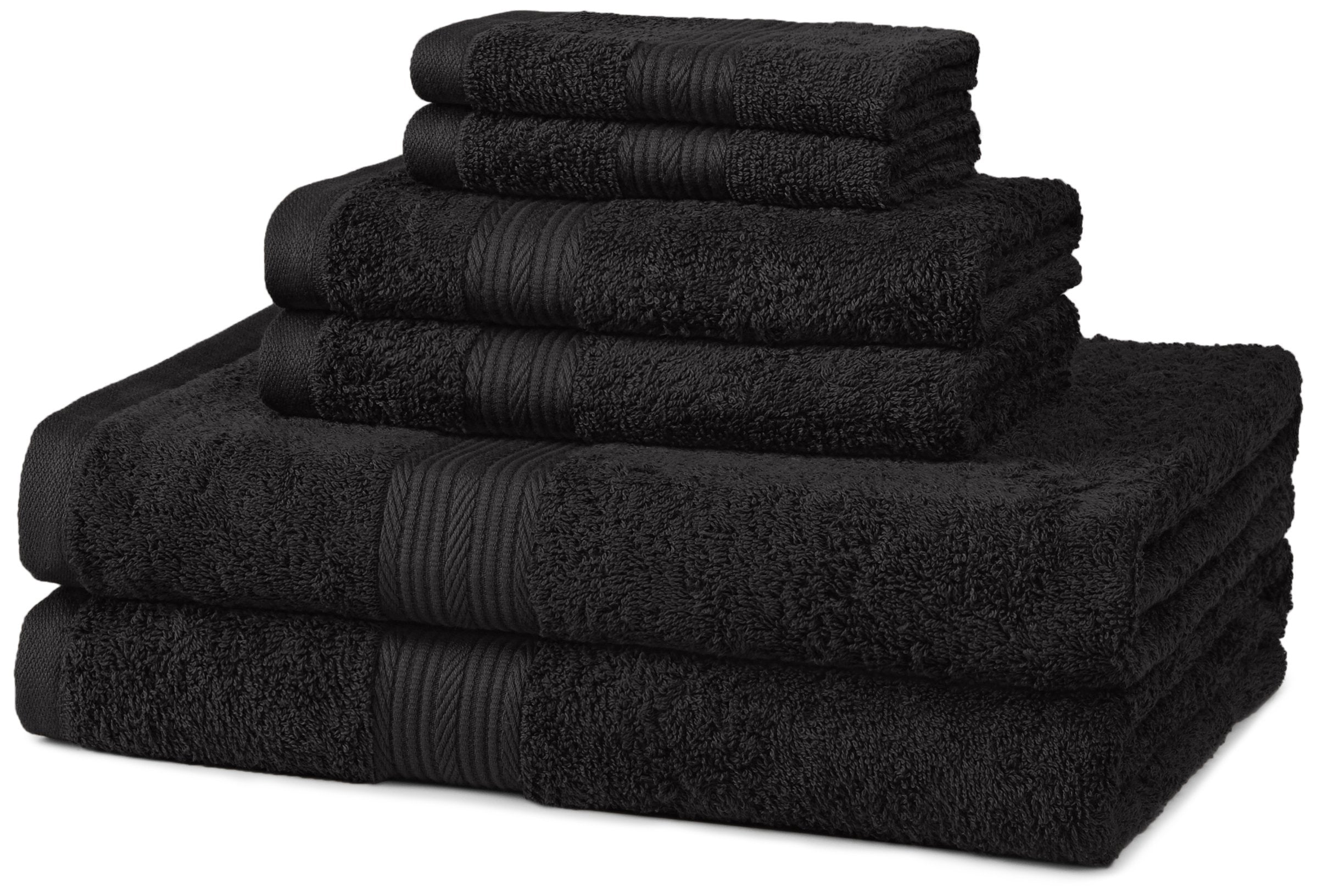 A stack of black towels of various sizes, neatly folded and placed together.