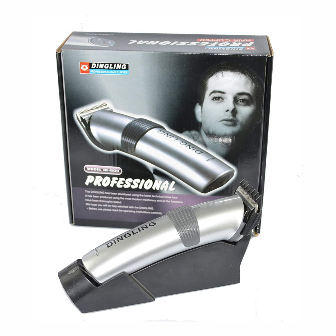 A Dingling brand professional hair trimmer with a metallic finish, displayed next to its packaging which features a man's face and the text 'PROFESSIONAL'.
