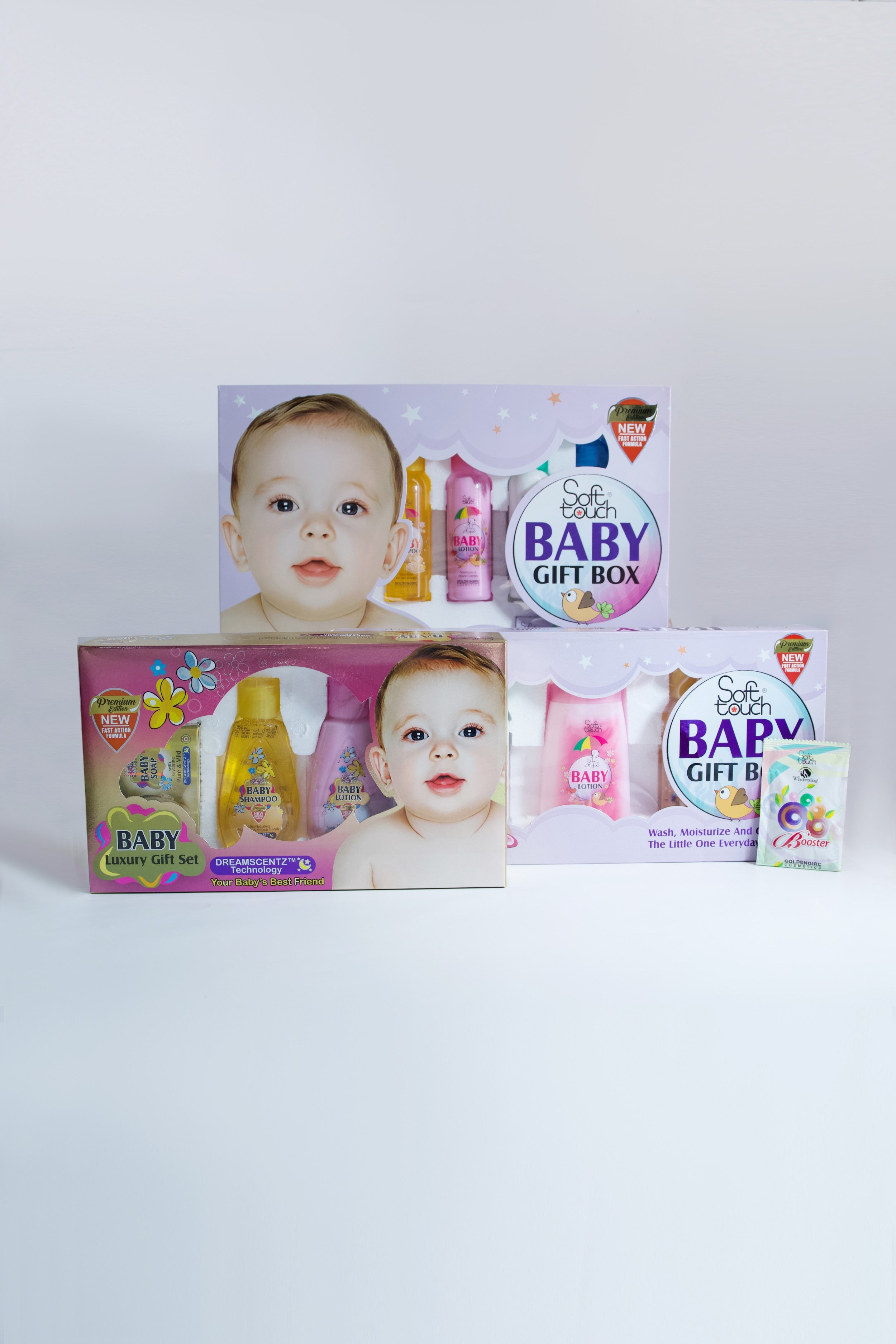 Baby gift box set with baby-themed products on a white background