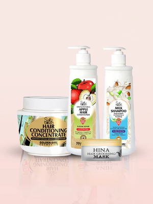 Set of hair care products including a jar, bottles, and a mask on a light pink background