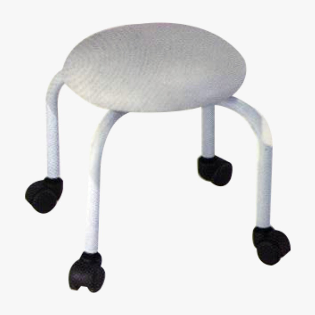 A white pedicure chair with black rubber feet and a textured top.