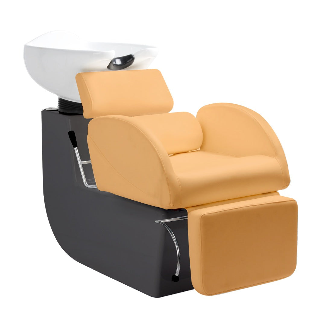 A modern shampoo chair with a solid steel body, finished in black and upholstered in beige, featuring a large seating area, extra-thick seat and back cushions, and an adjustable leg rest.