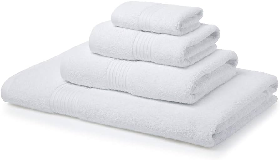 A stack of white towels on a flat surface.