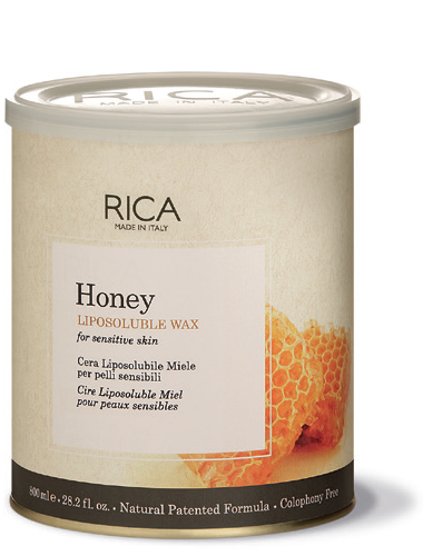 A container of Rica Honey Liposoluble Wax with a honeycomb design and information indicating it is suitable for sensitive skin.